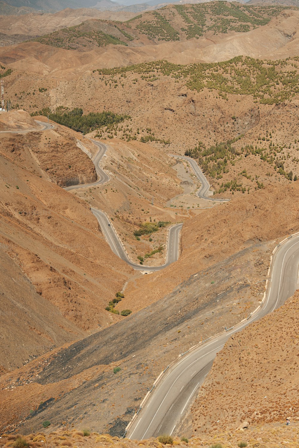 a view of a winding road in the mountains