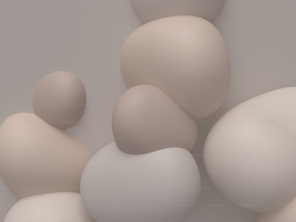 a group of white and beige balls on a gray background