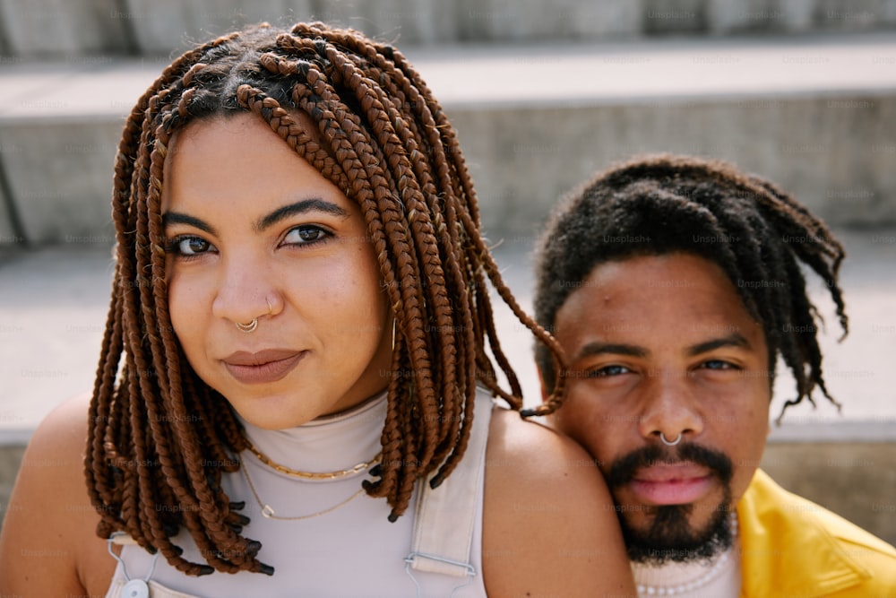 a man and a woman are posing for a picture