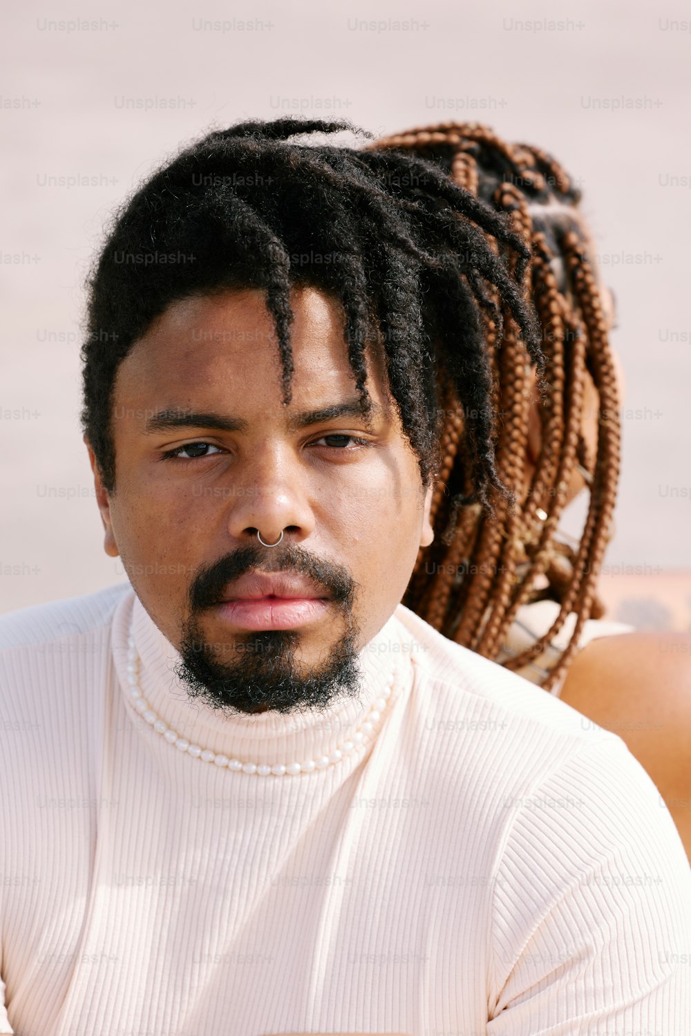 a close up of a person with dreadlocks