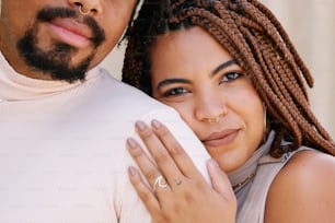 a man and a woman embracing each other