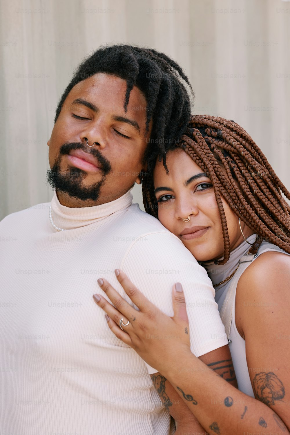 a man and a woman hugging each other