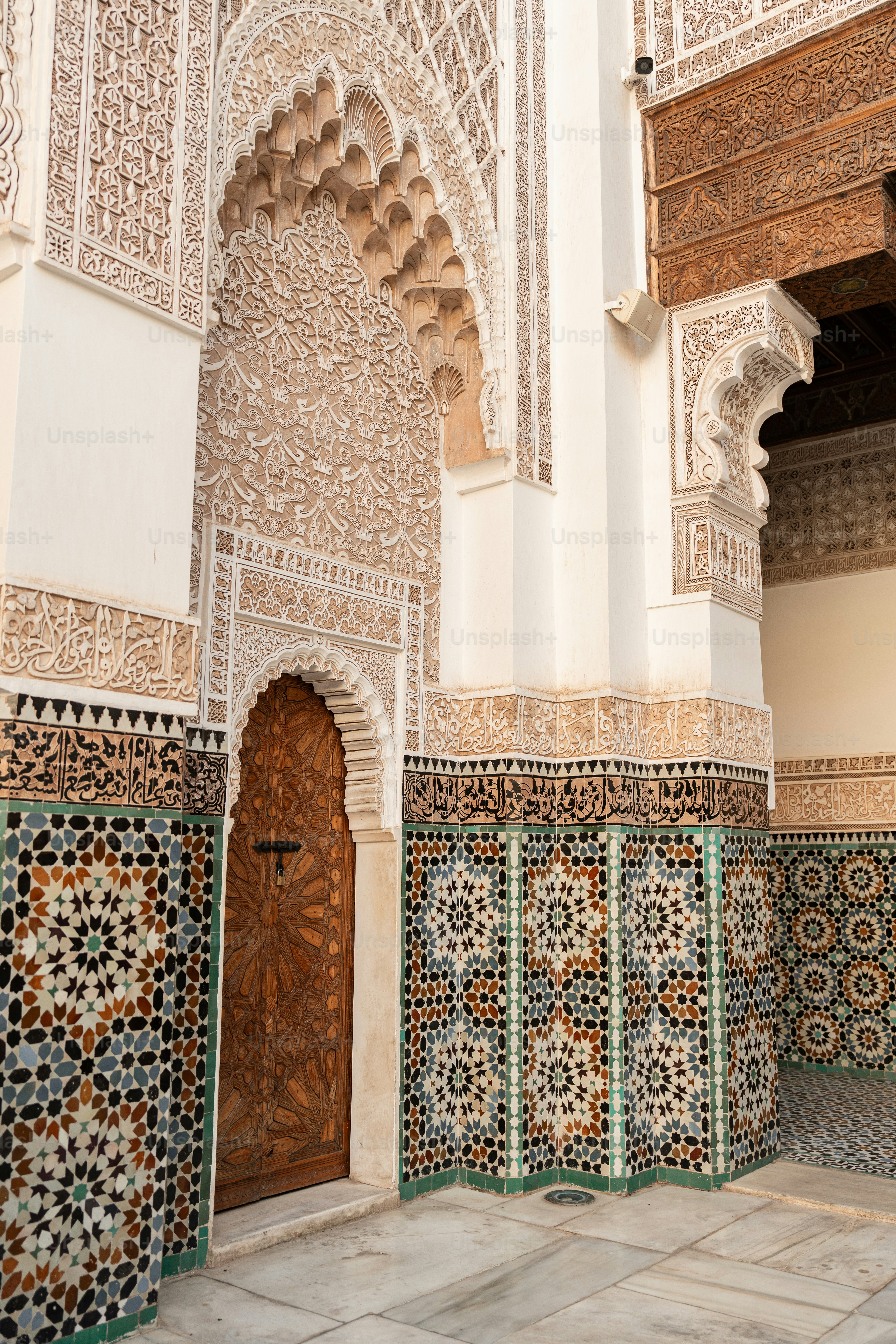 an ornate building with a cross on the door