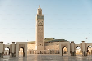 a large white building with a clock tower