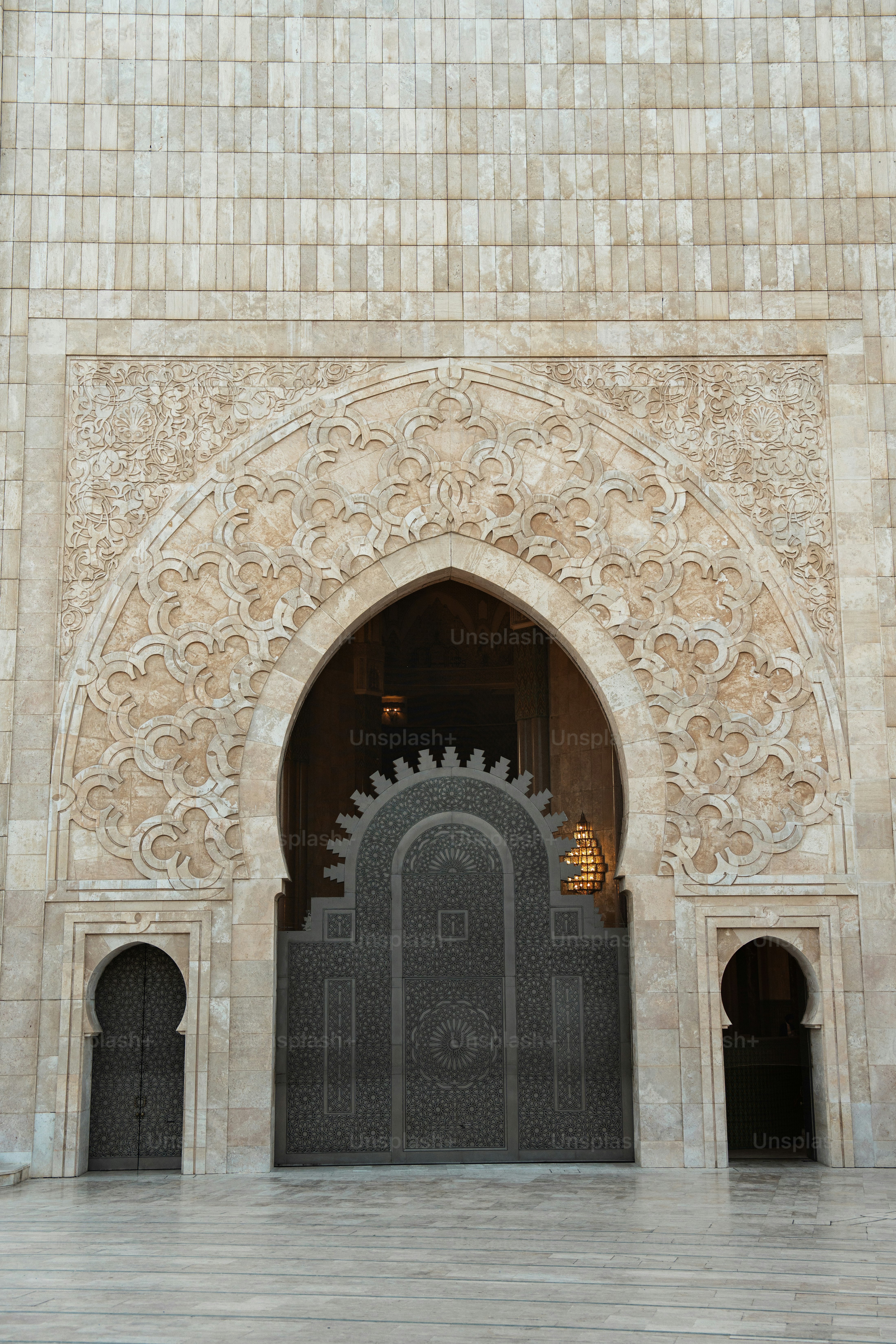 a large doorway with a clock on the side of it