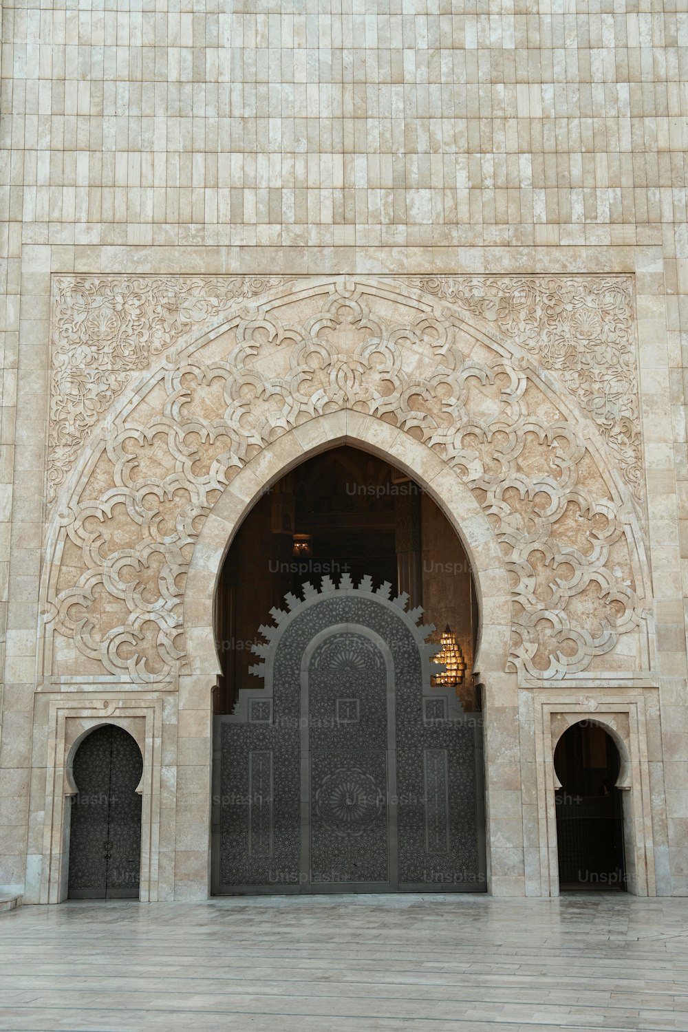 a large doorway with a clock on the side of it