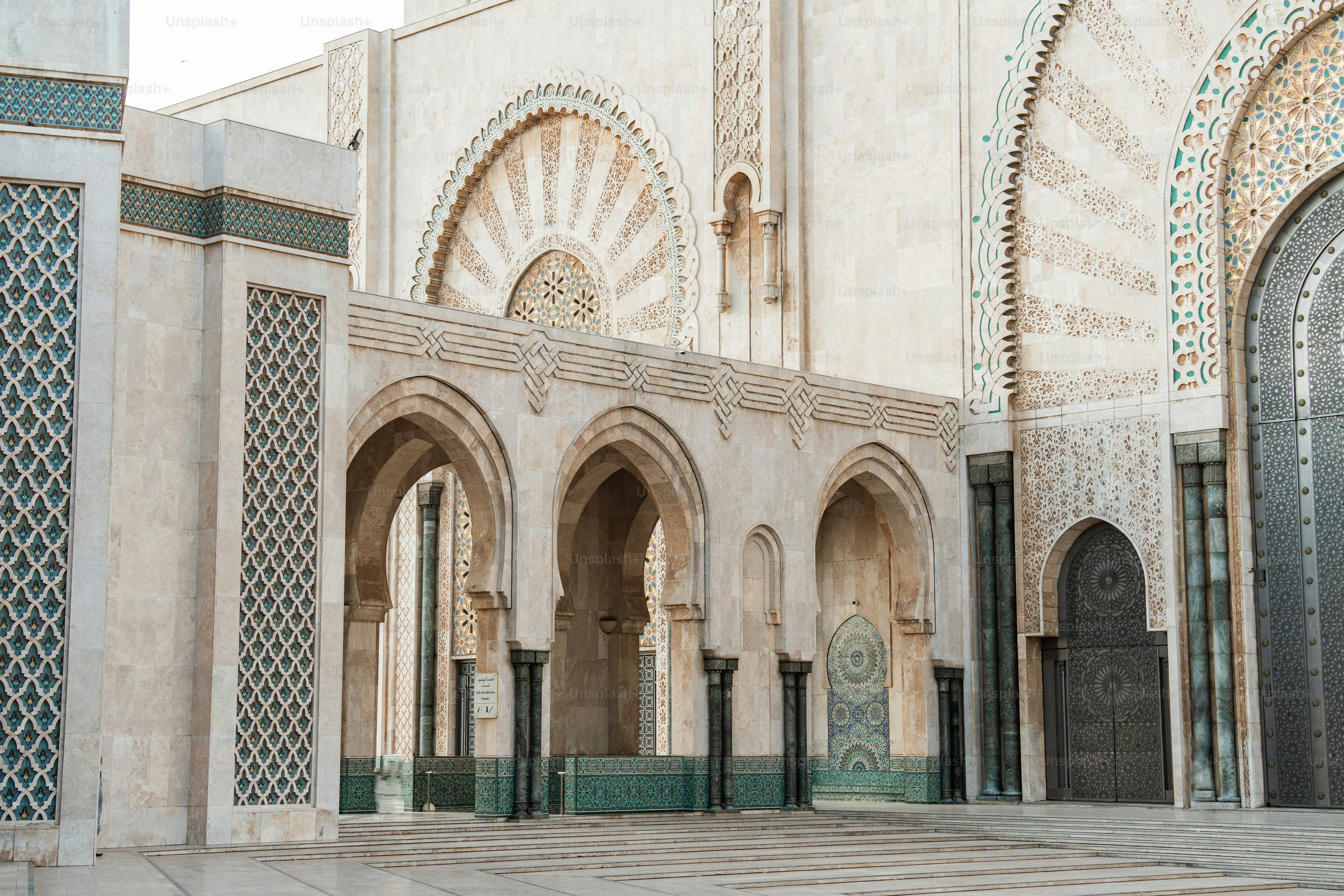 a large building with a lot of arches and doors