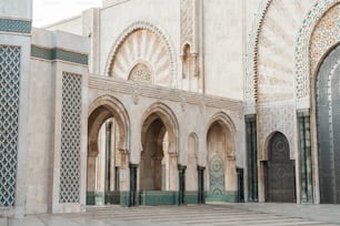 a large building with a lot of arches and doors