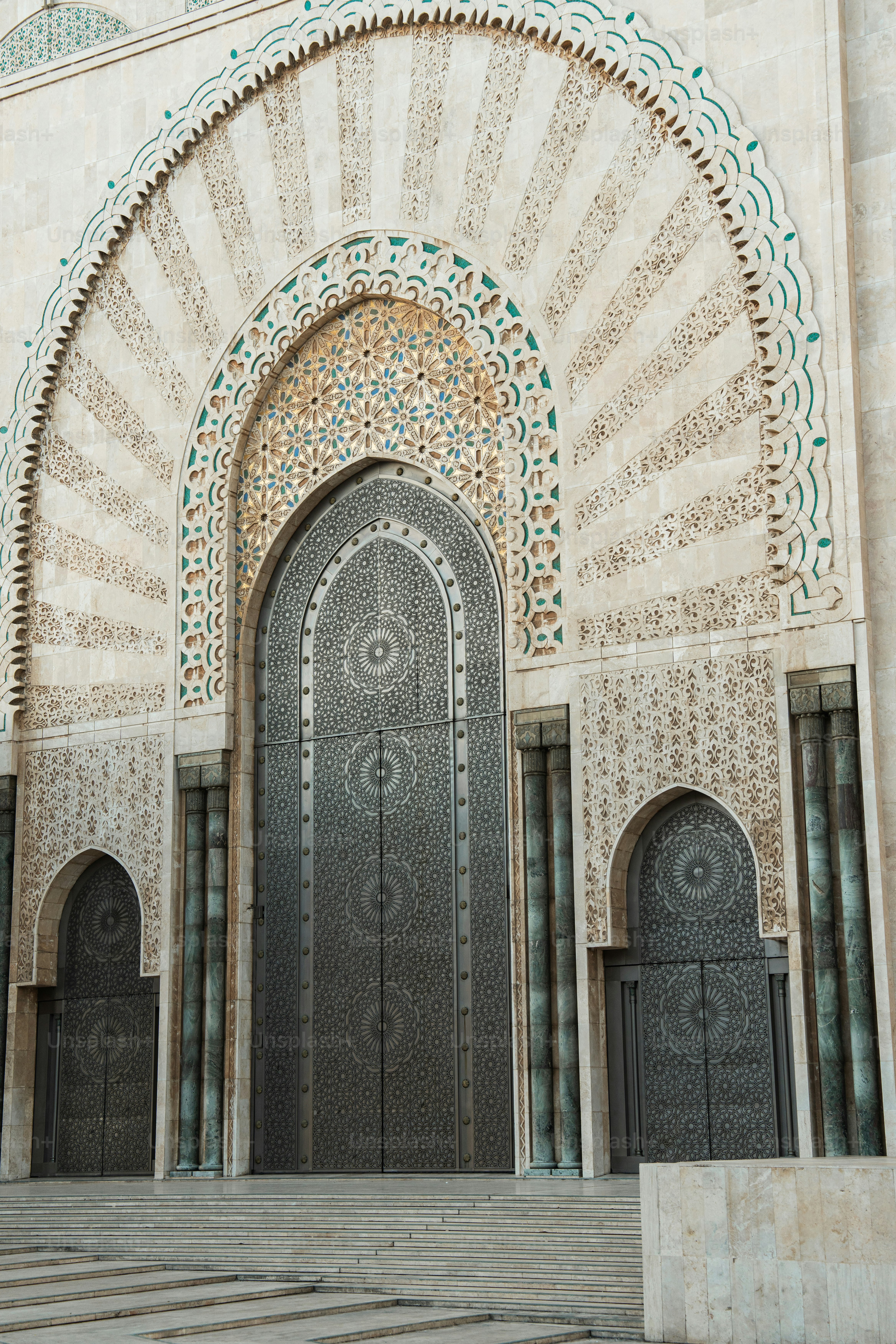 a building with a large door and steps leading up to it