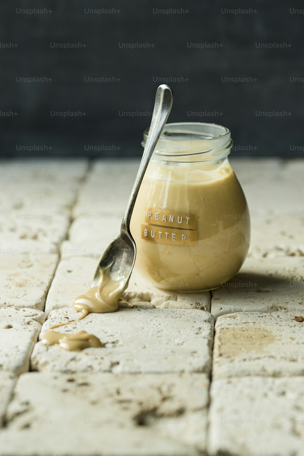 a jar of peanut butter with a spoon