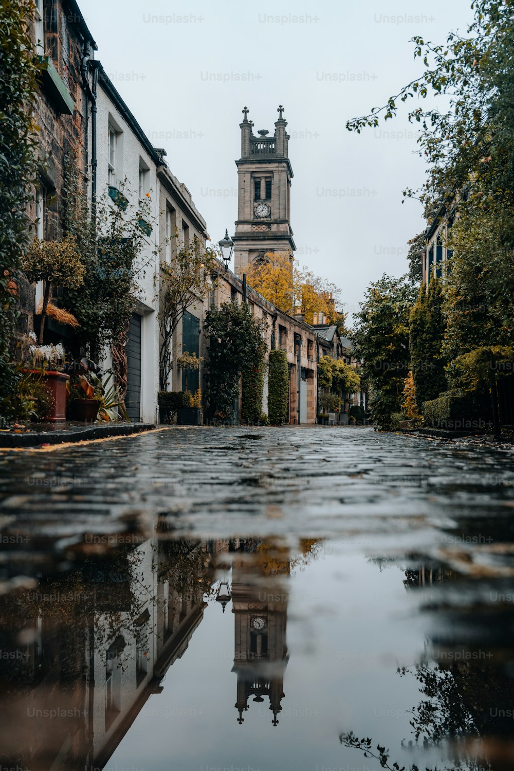 a city street with a clock tower in the background