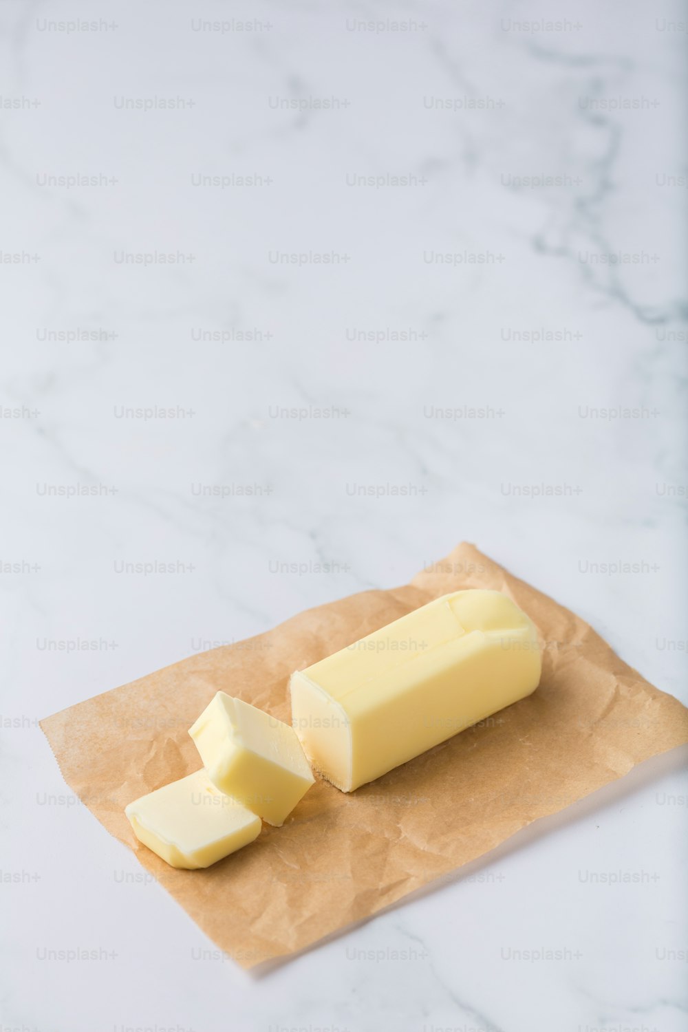 a block of butter on a piece of wax paper