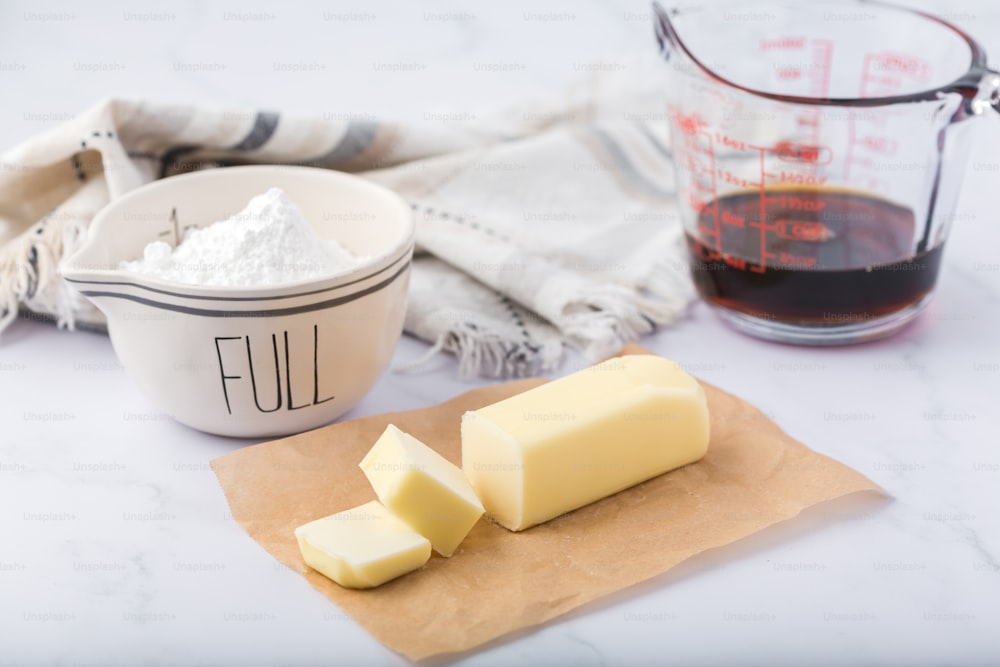 a couple of pieces of butter sitting on top of a counter