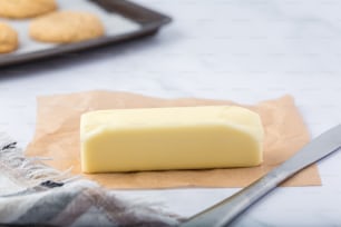 a block of butter next to some cookies