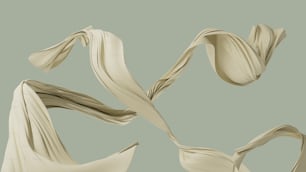 a group of flowing white cloths on a gray background