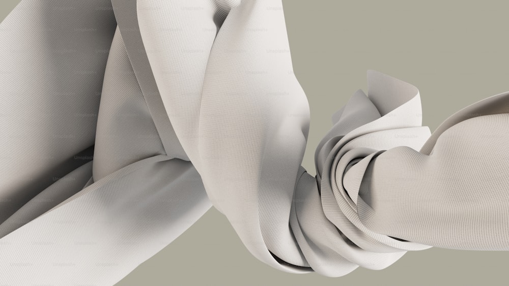un primo piano di una cravatta bianca su uno sfondo grigio