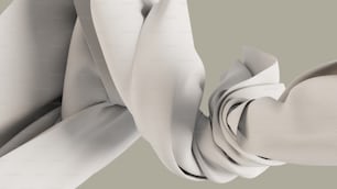 un primer plano de una corbata blanca sobre un fondo gris
