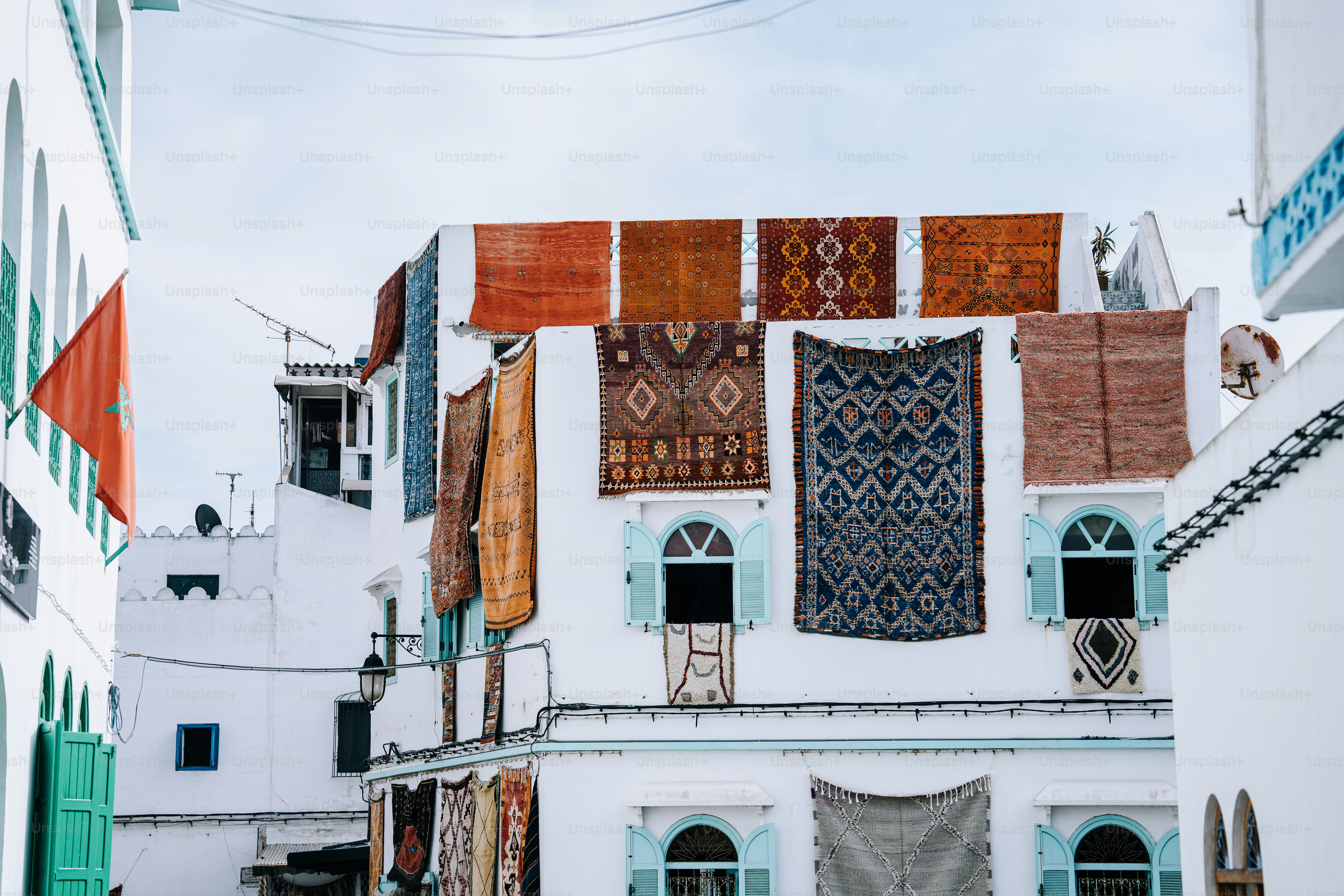 a white building with lots of different colored windows