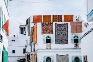 a white building with lots of different colored windows