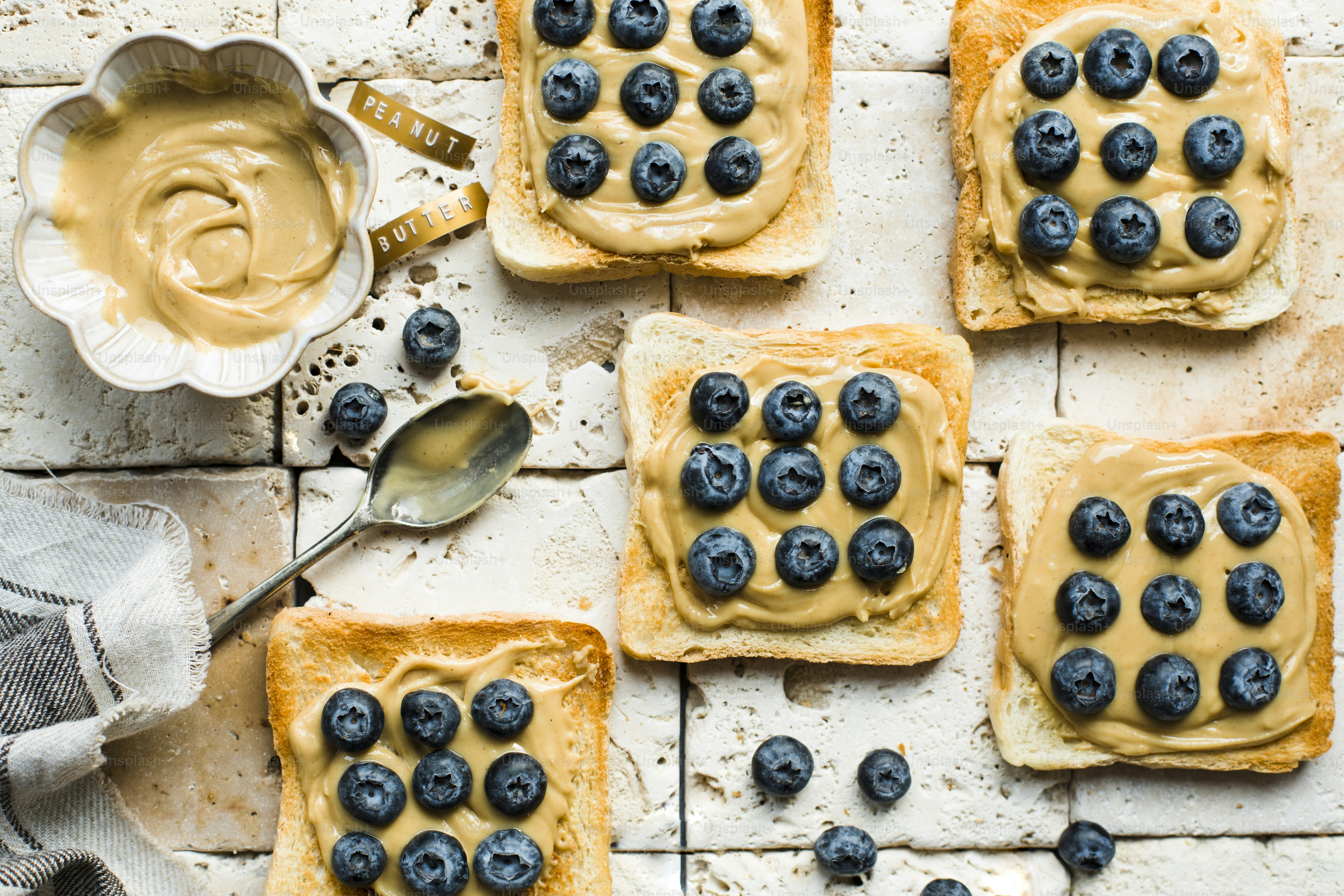 a table topped with blueberries and toast