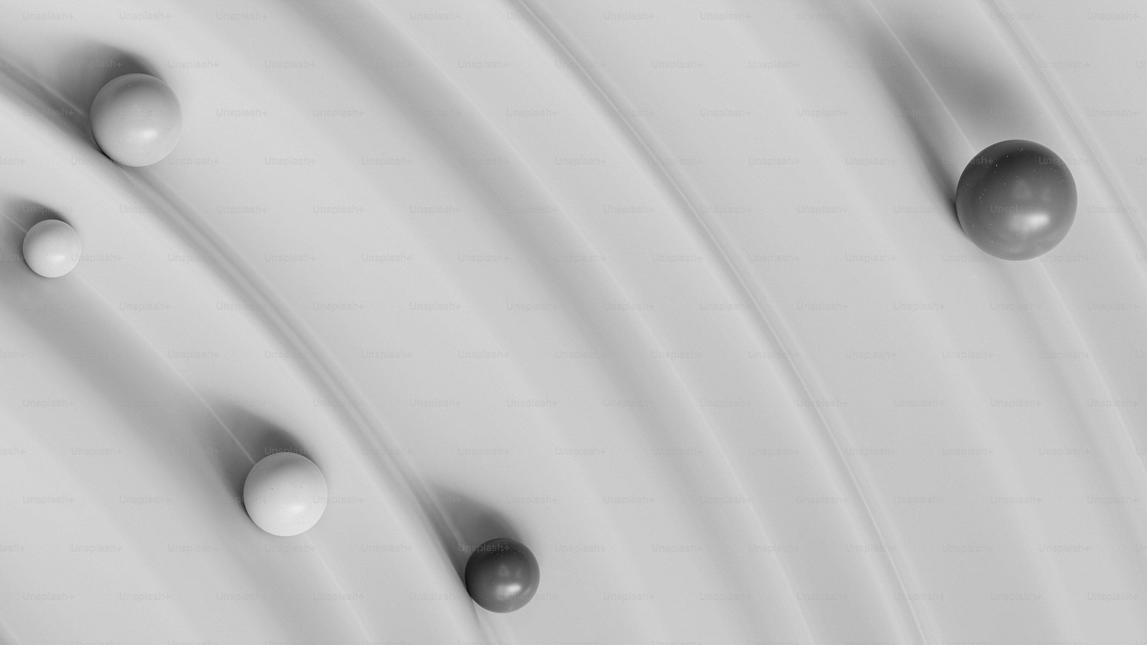 a close up of a bunch of balls on a surface