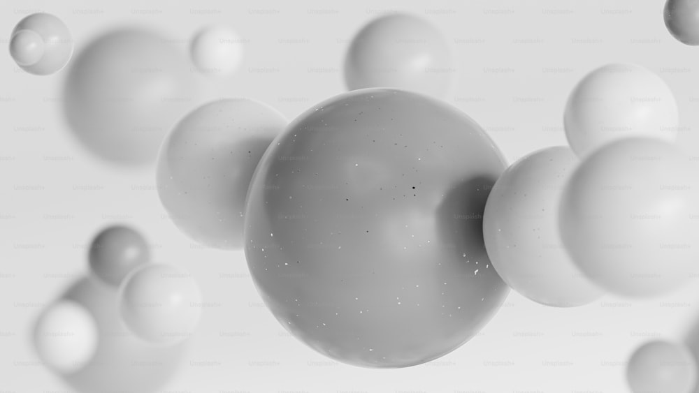un grupo de bolas blancas flotando en el aire