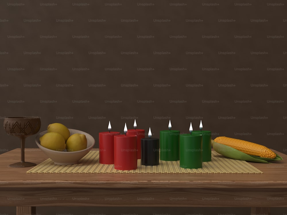 a table topped with candles and a bowl of fruit