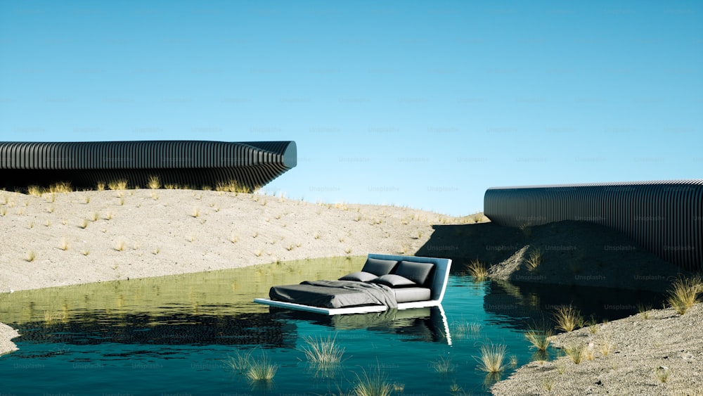 a couch sitting on top of a body of water
