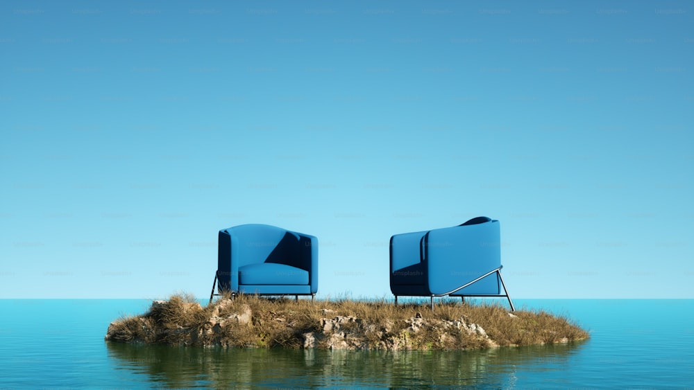 a couple of blue chairs sitting on top of a small island