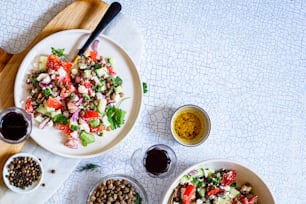 a table topped with two bowls of food