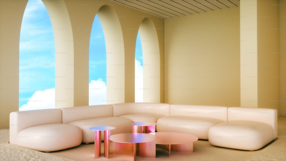 a room with a couch, tables, and arches