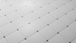 a close up view of a white tile wall