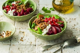 a couple of bowls filled with food on top of a table