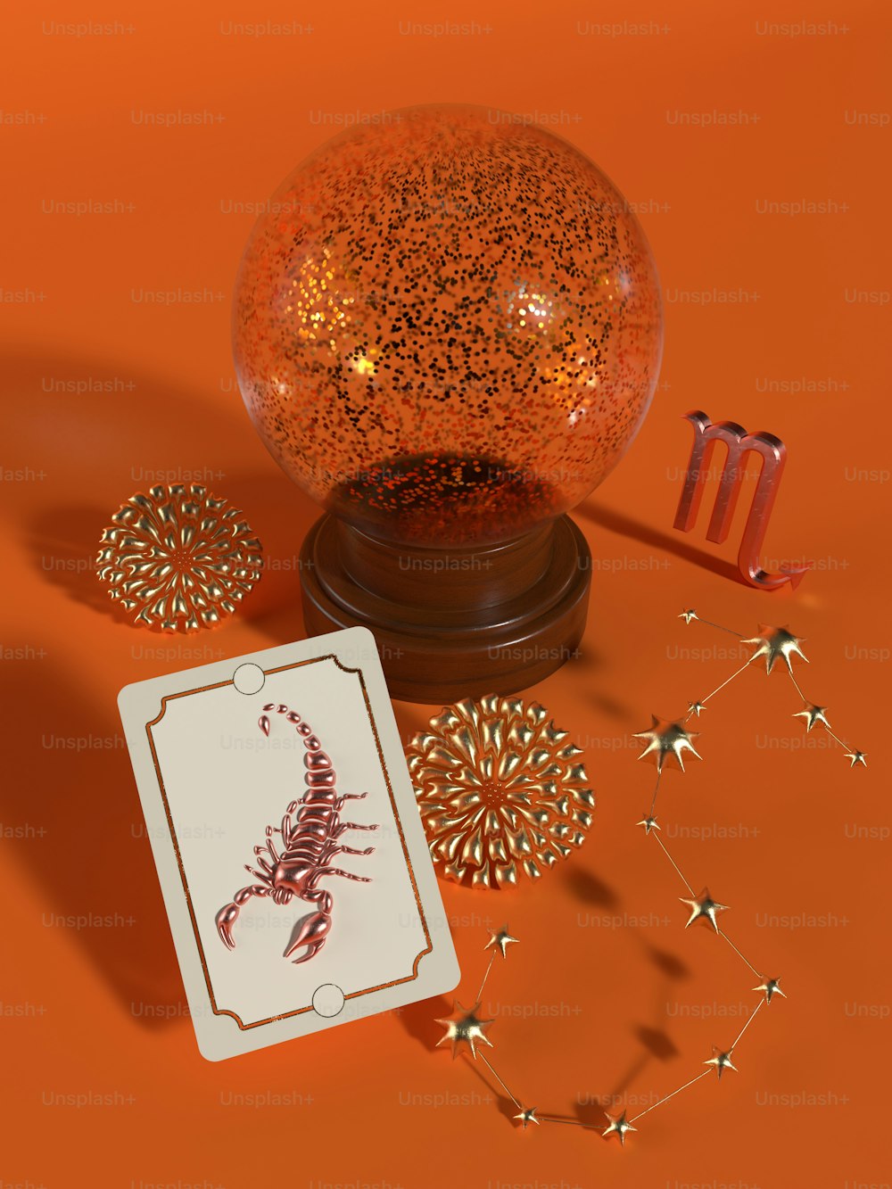 a card next to a glass ball with a scorpion on it