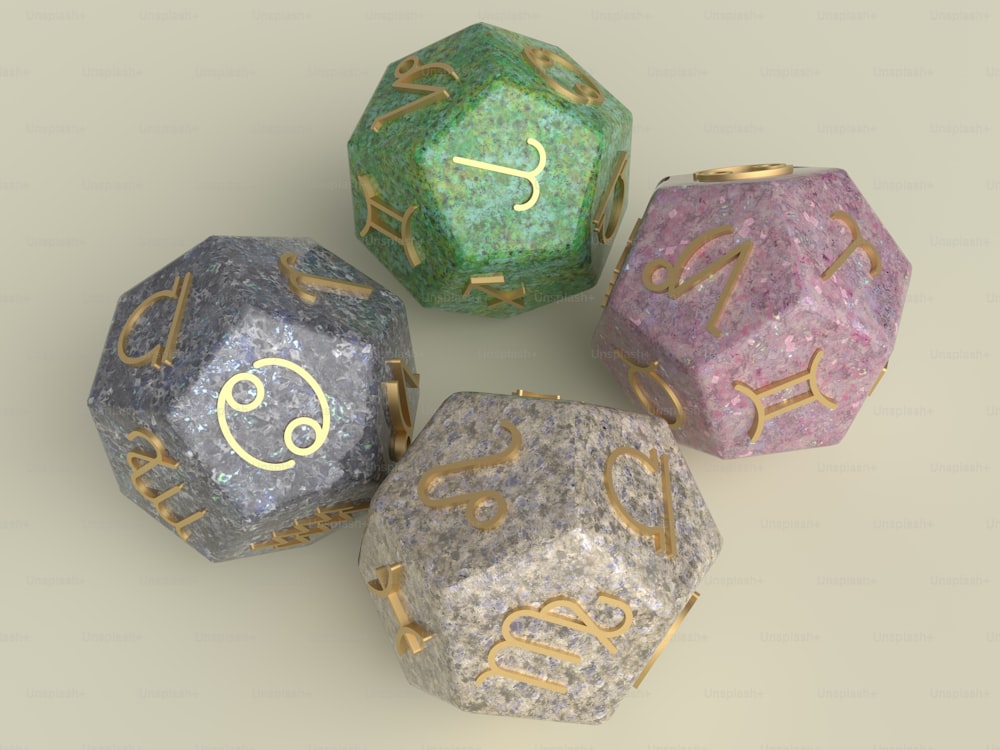 three different colored dices with gold numbers on them