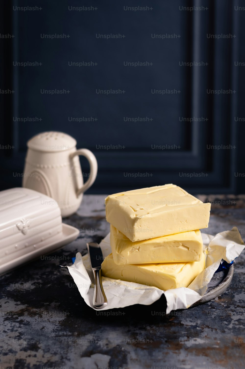 a pile of yellow cake sitting on top of a table