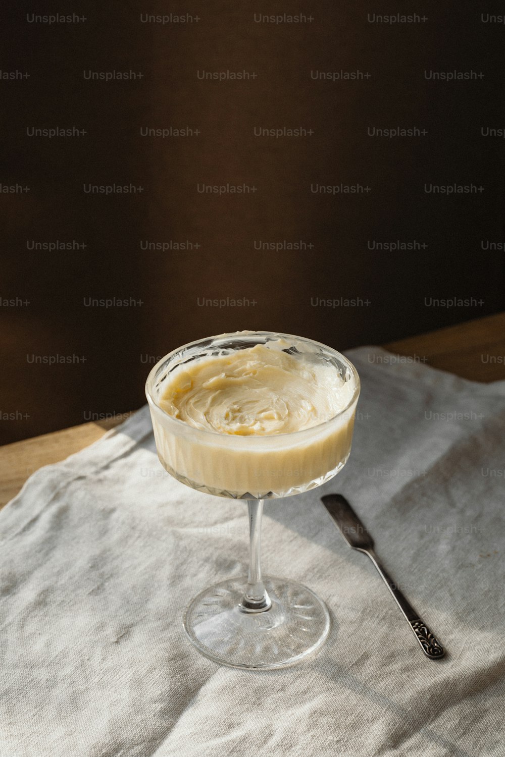 a dessert in a glass on a table
