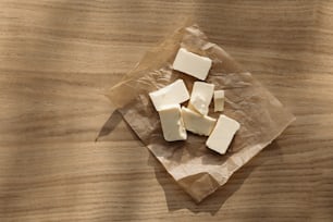 several pieces of cheese on a piece of wax paper