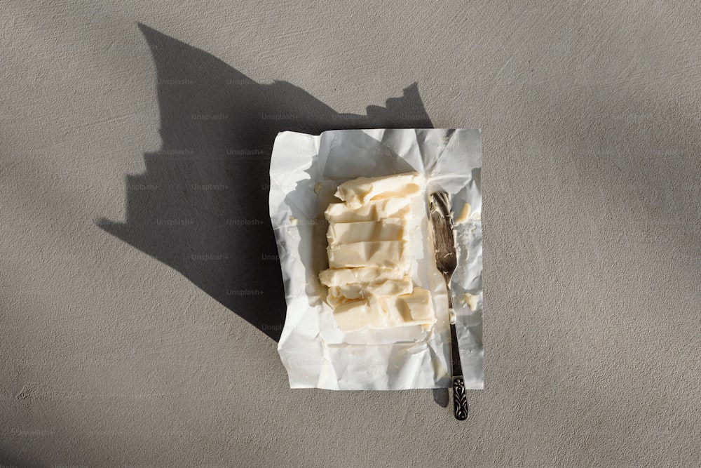 a piece of butter on a napkin with a spoon