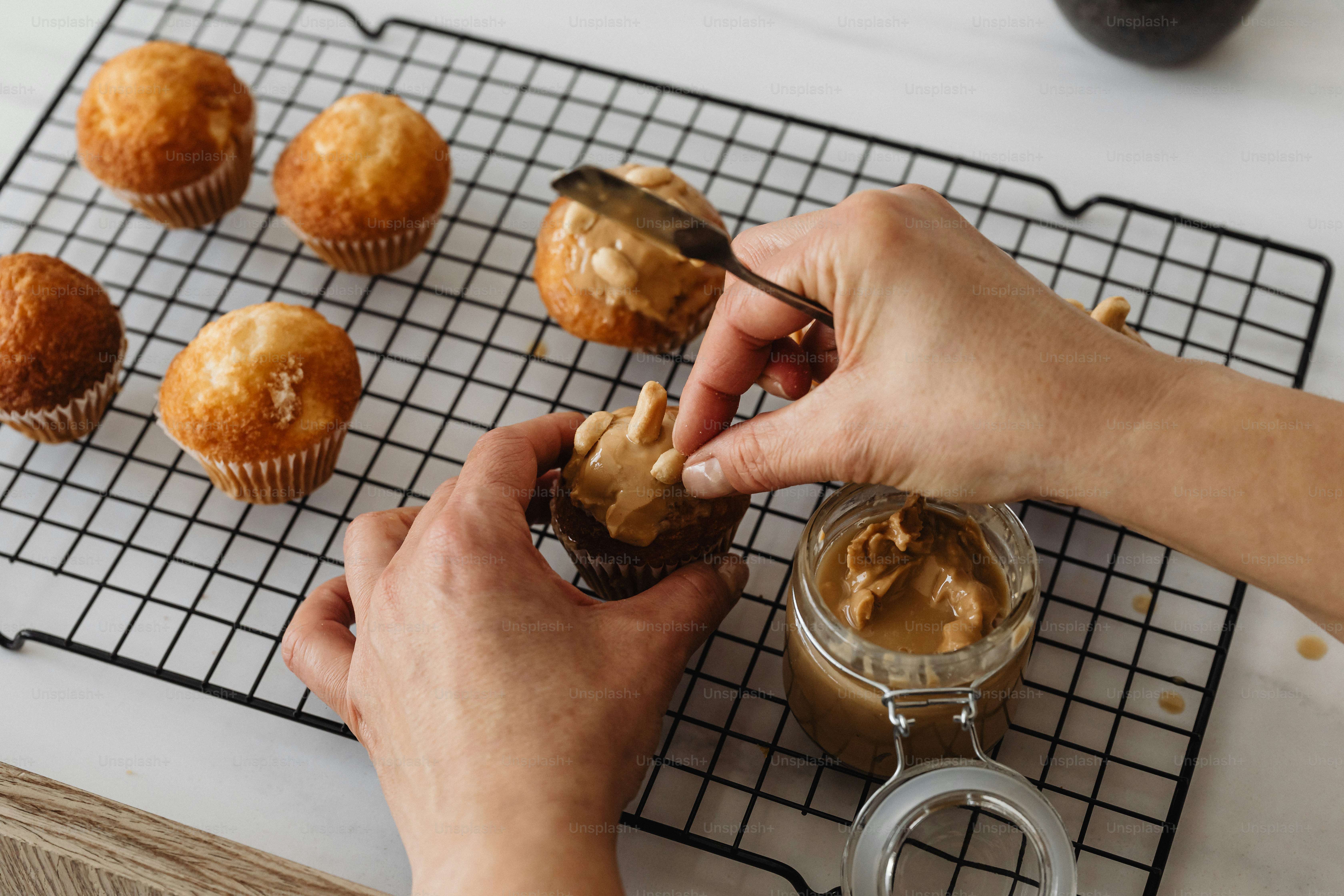 A person putting peanut butter on a muffin photo Food Image on Unsplash