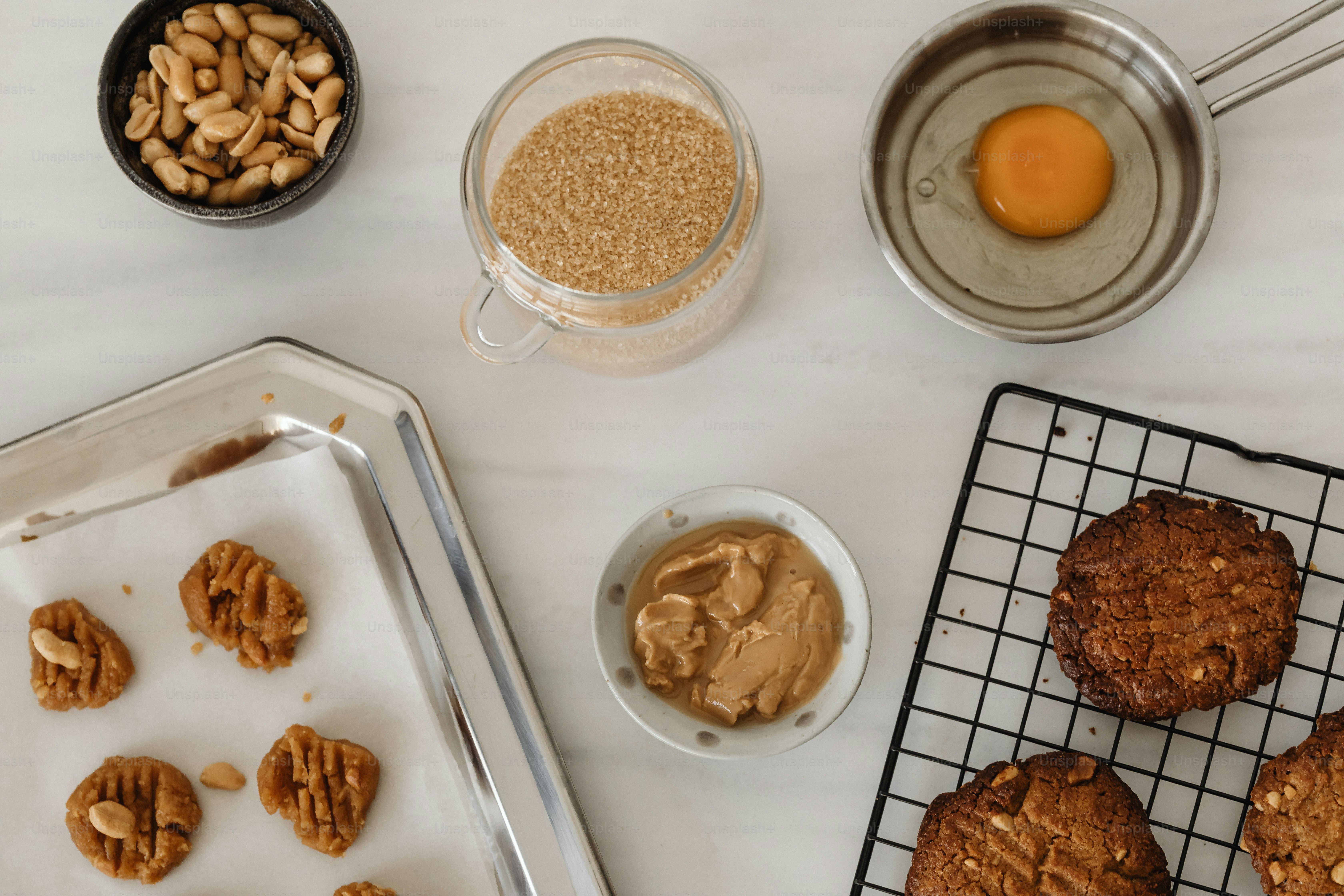 a table topped with cookies and peanut butter