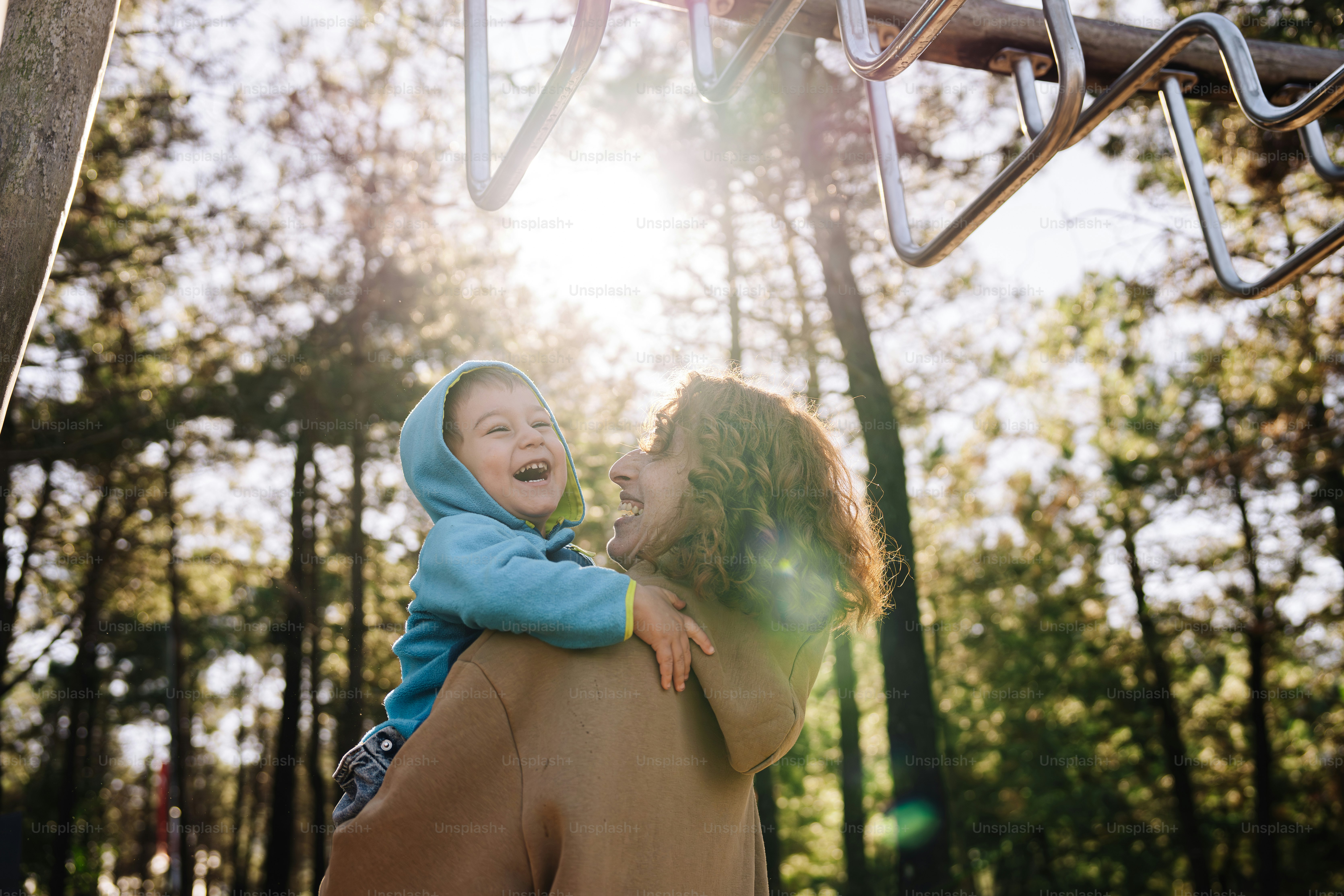 a woman holding a small child in her arms