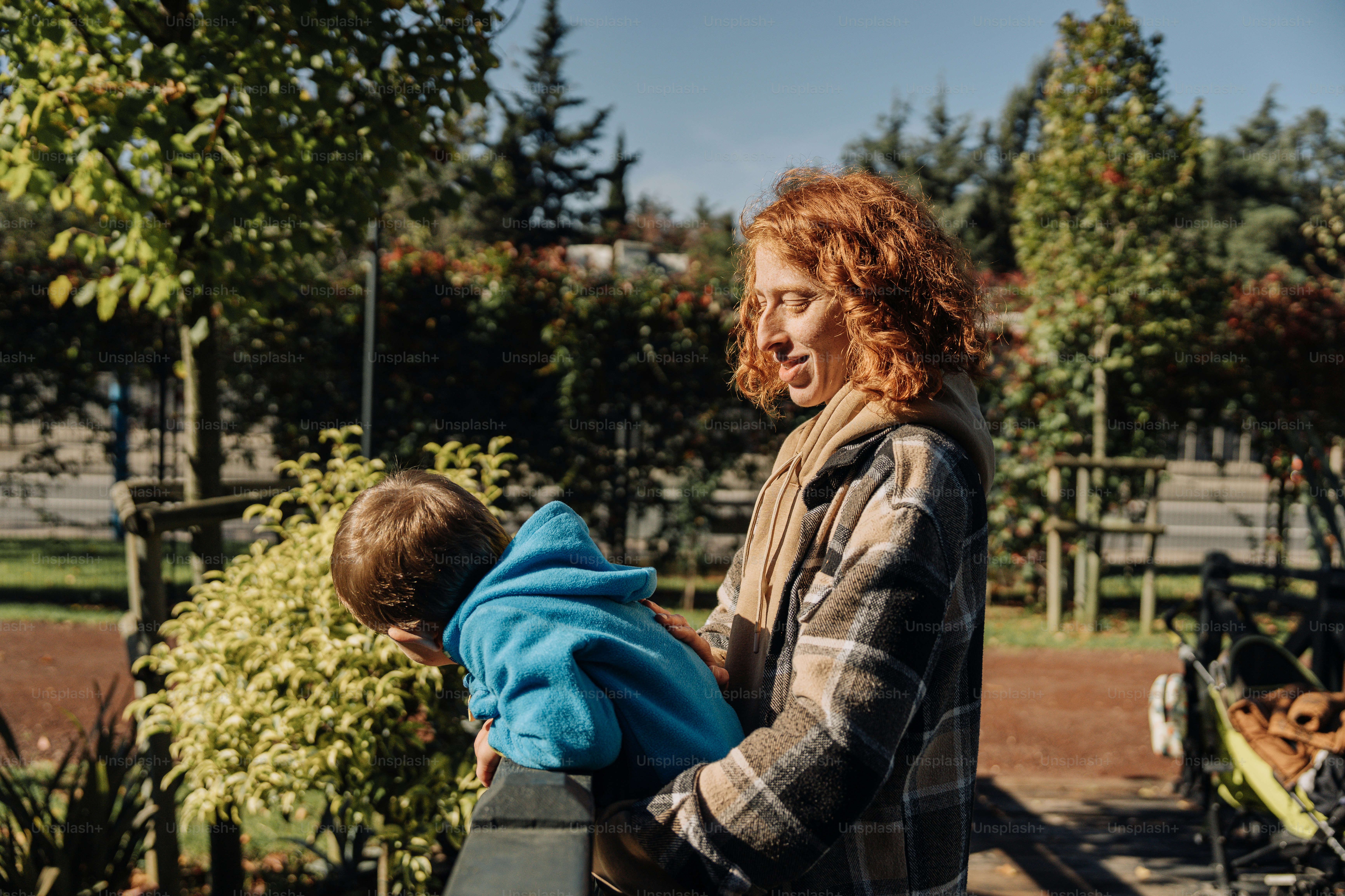 a woman holding a child in her arms