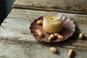 a jar of peanut butter on a plate