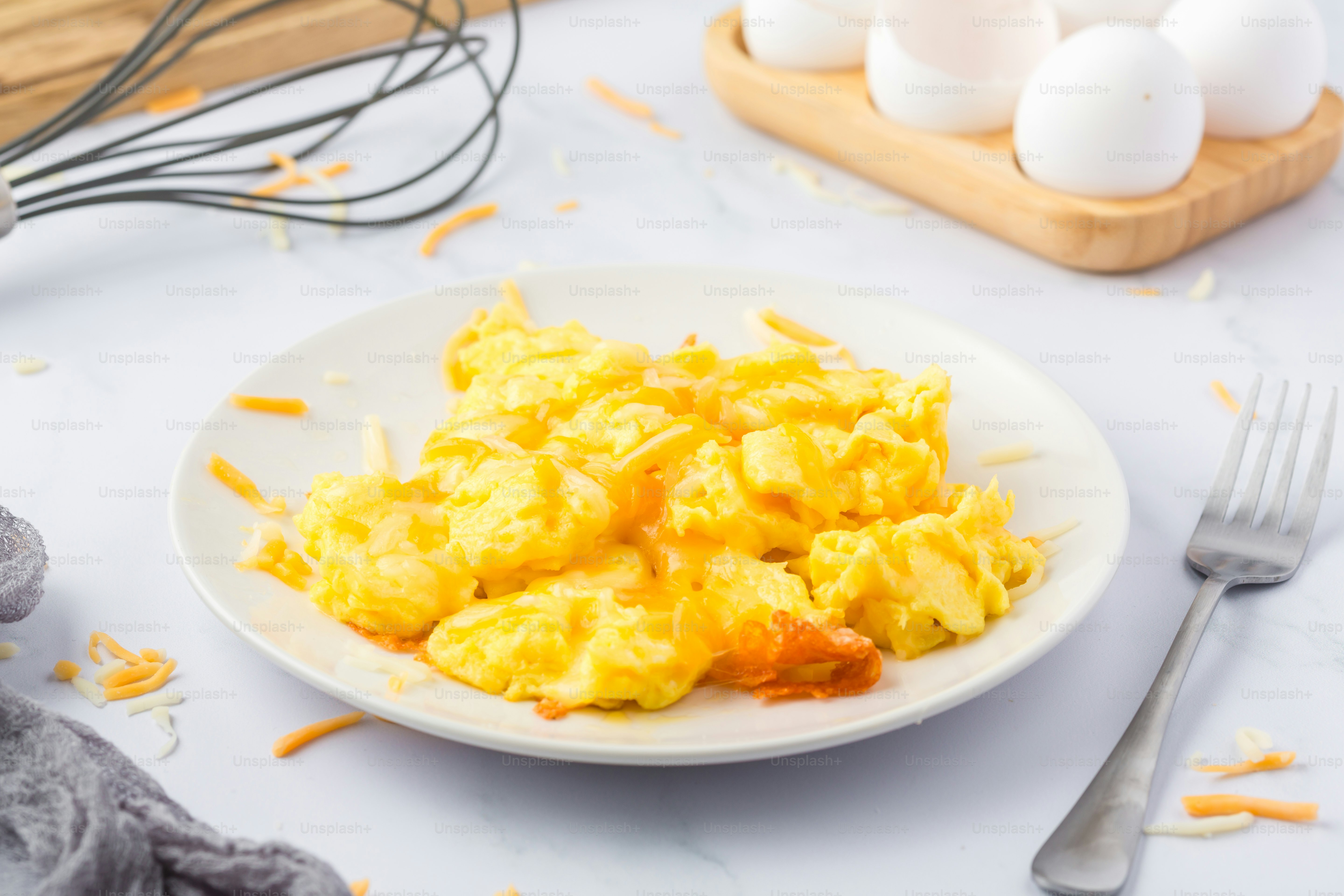 a plate of scrambled eggs on a table