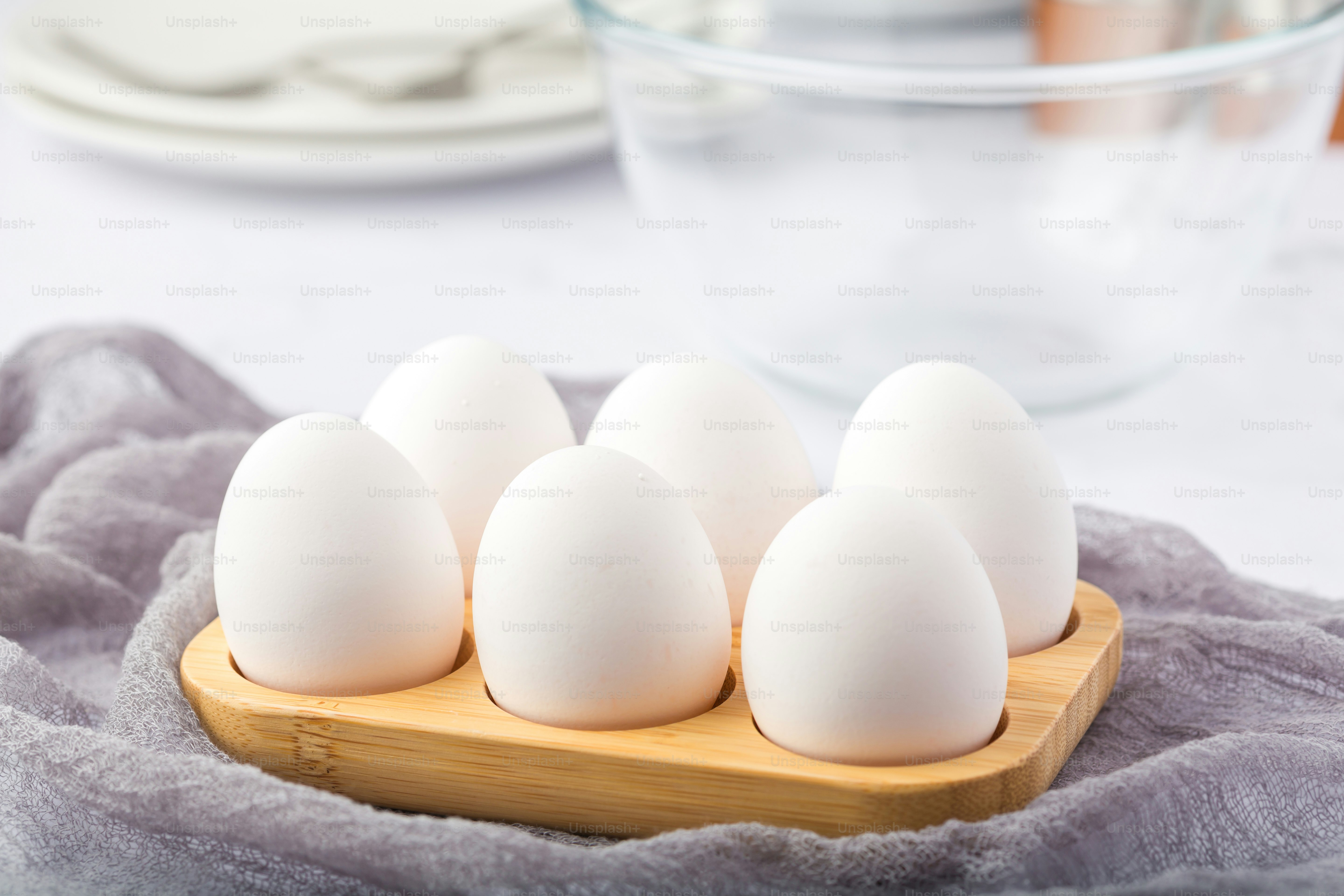 Six white eggs in a wooden tray on a table photo Eggs Image on Unsplash