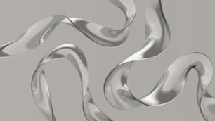 a group of shiny metal objects on a gray background