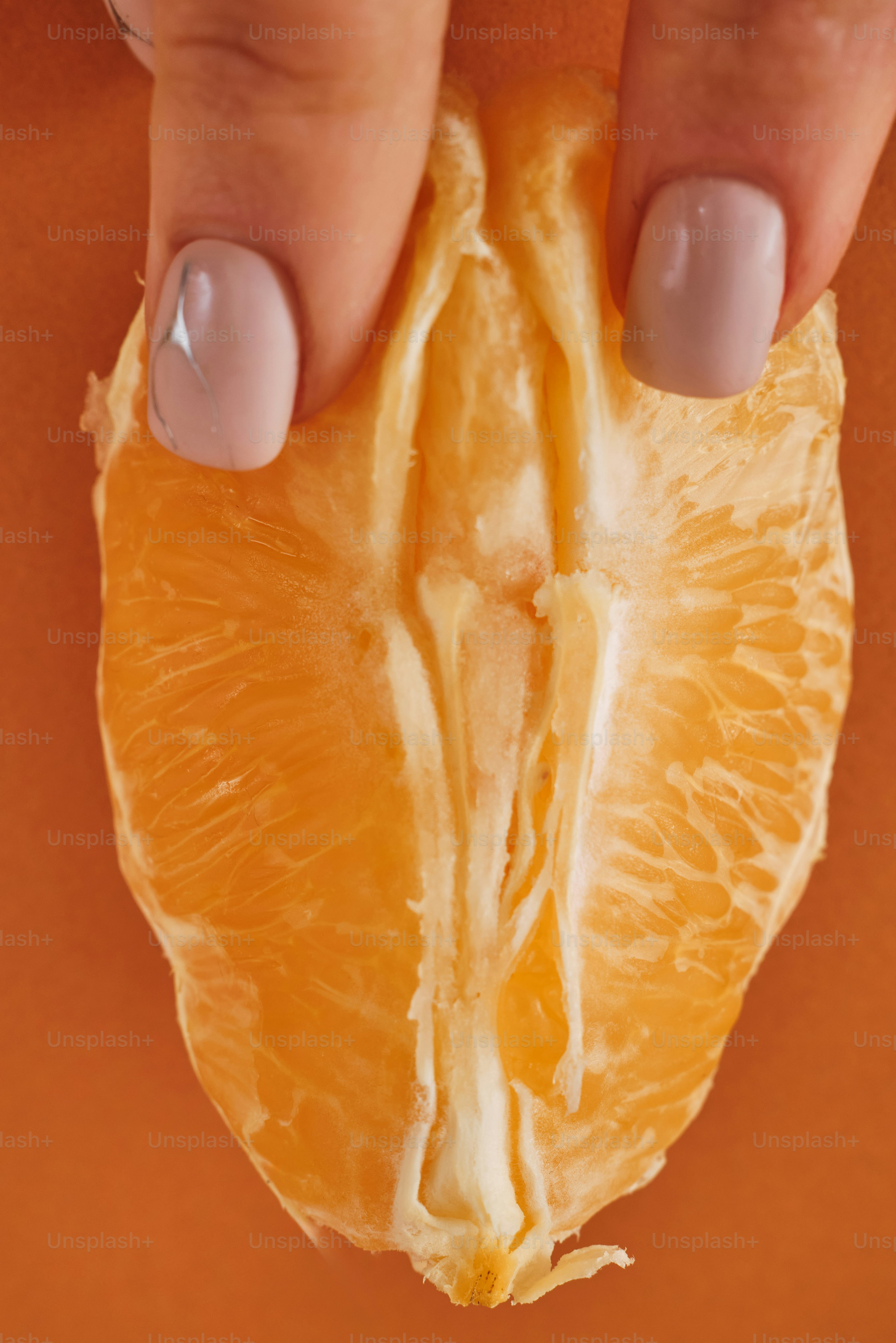 a cut of a citrus fruit resembling a woman's vulva