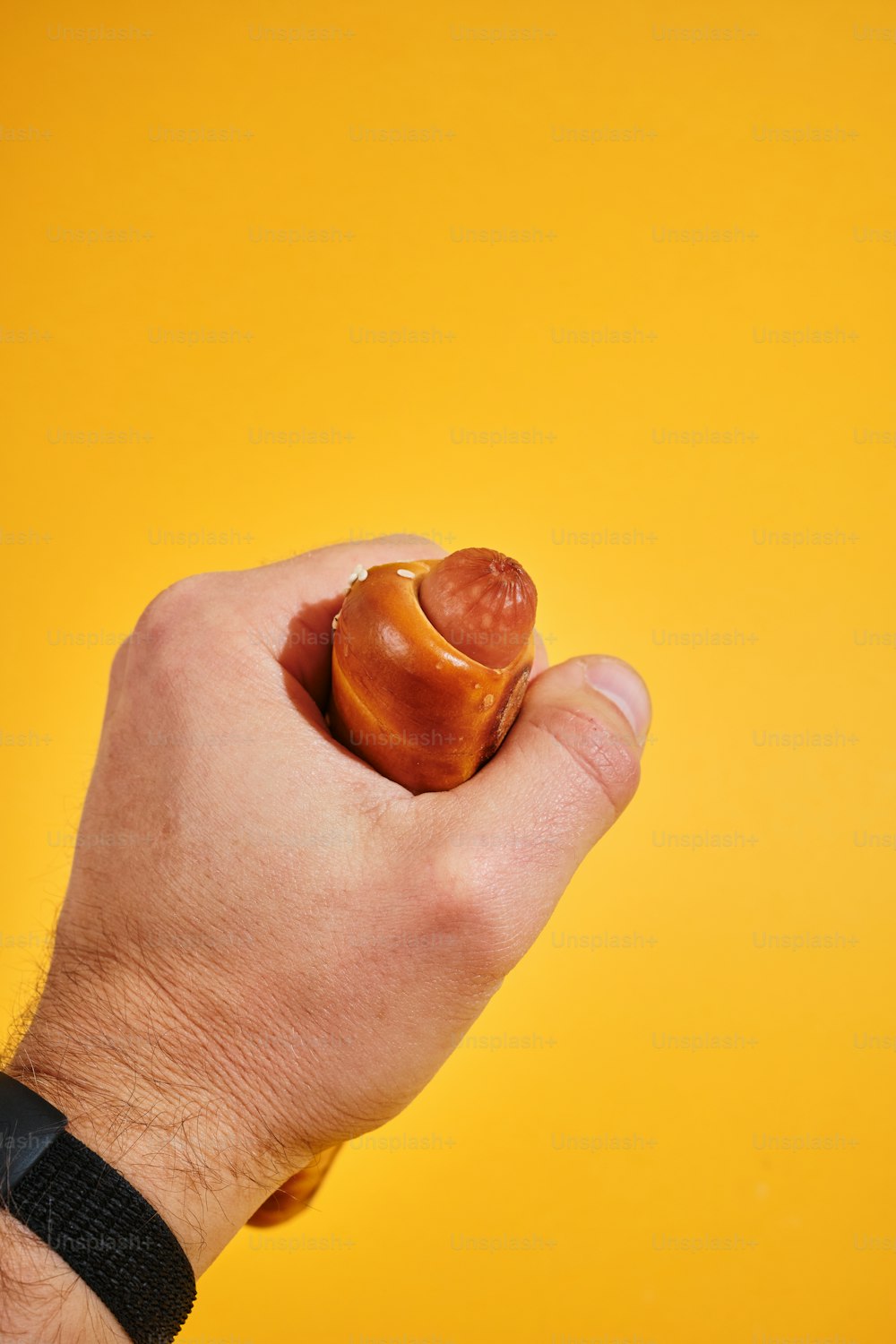 a hand holding a small piece of food