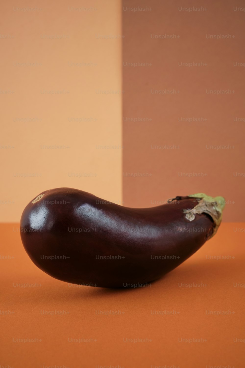 a brown eggplant sitting on top of a table